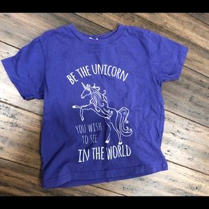 A purple custom made girls shirt with a unicorn